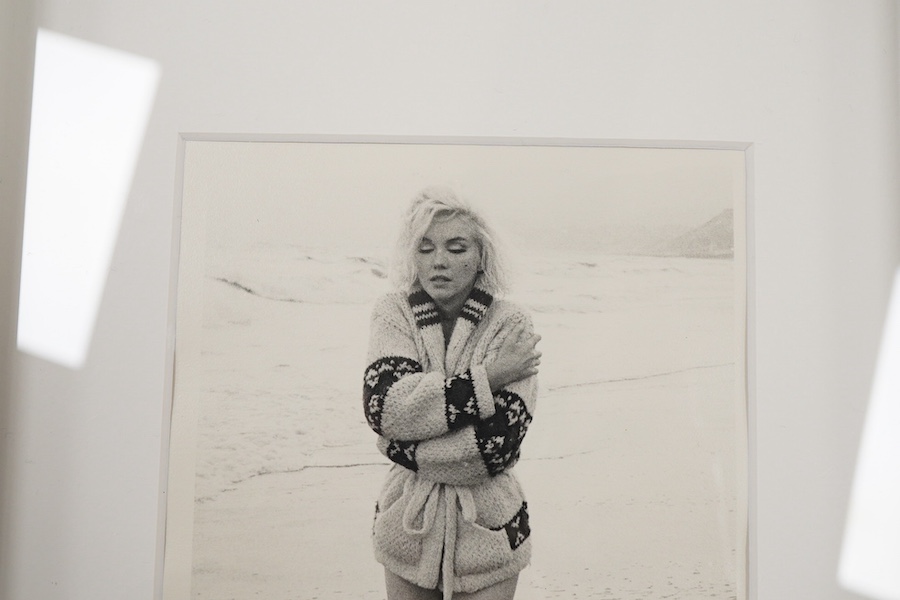 George Barris, a black and white photograph of from Marilyn Monroe's last photoshoot, taken on Santa Monica beach in July 1962, shortly before her death, signed in black ink by Barris to the lower edge of the image, stam